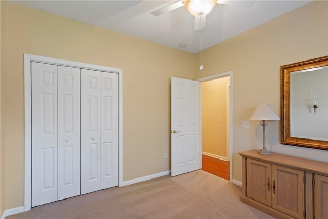 704 Nottingham Ct, Seneca, SC 29672 - unfurnished bedroom featuring light colored carpet, a closet, and a ceiling fan