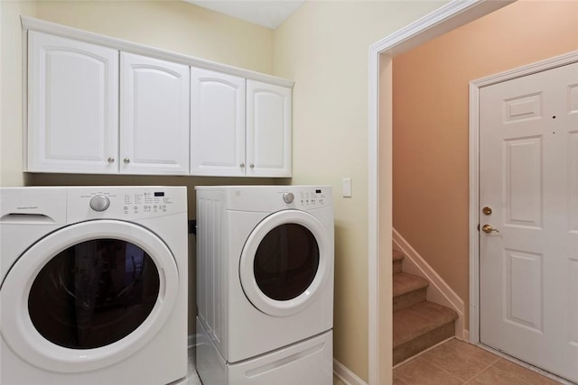 704 Nottingham Ct, Seneca, SC 29672 - washroom featuring separate washer and dryer, cabinet space, and light tile patterned floors
