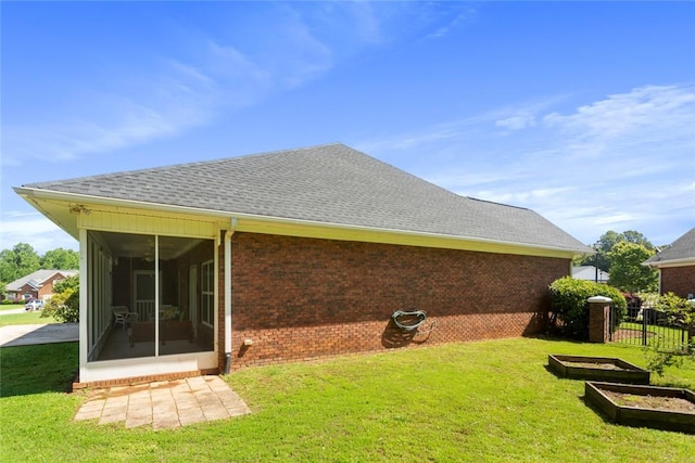 704 Nottingham Ct, Seneca, SC 29672 - rear view of property with a sunroom, brick siding, roof with shingles, and a garden