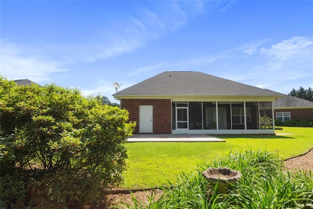 704 Nottingham Ct, Seneca, SC 29672 - rear view of house with a yard, a sunroom, a patio area, and brick siding