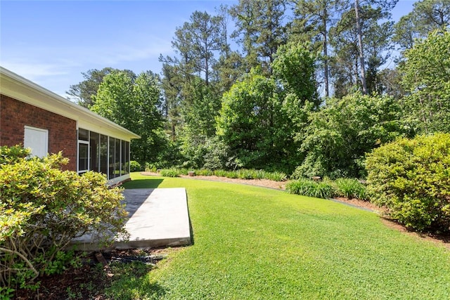 704 Nottingham Ct, Seneca, SC 29672 - view of green lawn featuring a patio and a sunroom