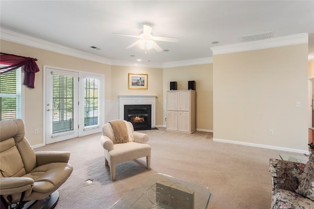 704 Nottingham Ct, Seneca, SC 29672 - living room featuring a ceiling fan, light colored carpet, crown molding, and a fireplace with flush hearth