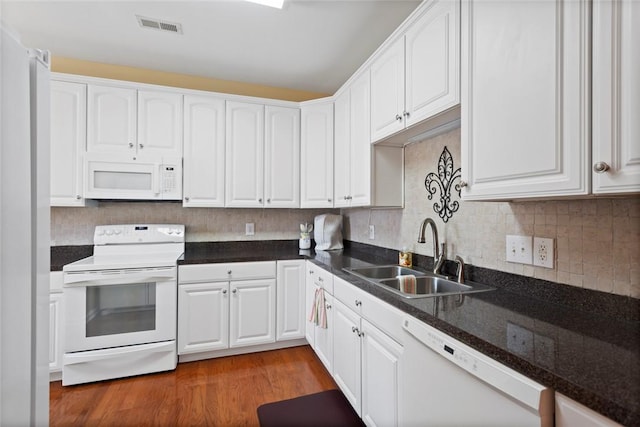 704 Nottingham Ct, Seneca, SC 29672 - kitchen featuring white appliances, white cabinets, wood finished floors, and decorative backsplash