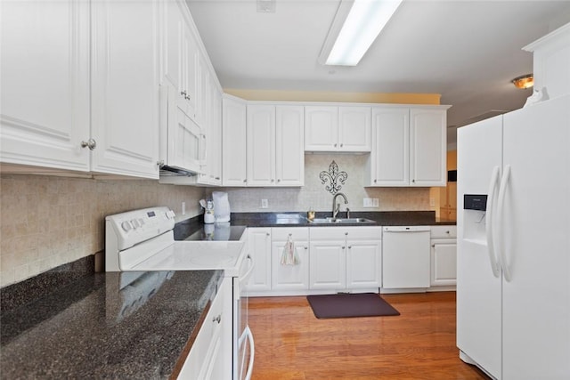 704 Nottingham Ct, Seneca, SC 29672 - kitchen featuring white appliances, white cabinets, decorative backsplash, light wood-type flooring, and dark stone countertops