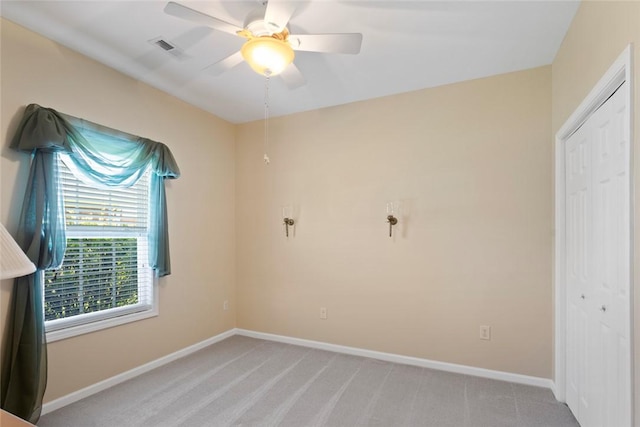 704 Nottingham Ct, Seneca, SC 29672 - unfurnished bedroom with light carpet, a ceiling fan, and a closet