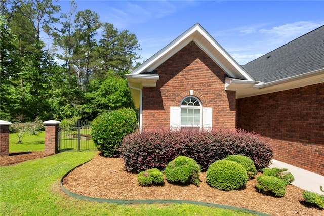 704 Nottingham Ct, Seneca, SC 29672 - view of home's exterior featuring brick siding and roof with shingles