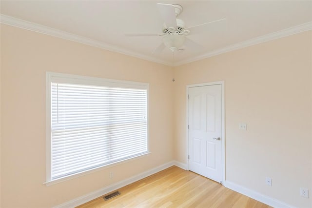 207 W Green Chase, Anderson, SC 29621 - spare room with light wood-style floors, baseboards, a ceiling fan, healthy amount of natural light, and crown molding