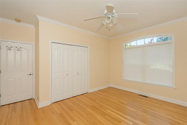 207 W Green Chase, Anderson, SC 29621 - unfurnished bedroom featuring light wood-style flooring, baseboards, ornamental molding, and a closet