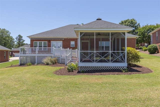 207 W Green Chase, Anderson, SC 29621 - rear view of property featuring a sunroom, a wooden deck, a lawn, roof with shingles, and brick siding