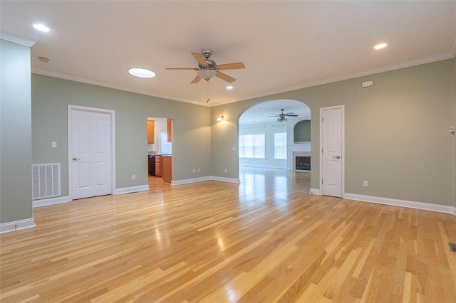 207 W Green Chase, Anderson, SC 29621 - spare room with a ceiling fan, arched walkways, light wood-style floors, ornamental molding, and baseboards