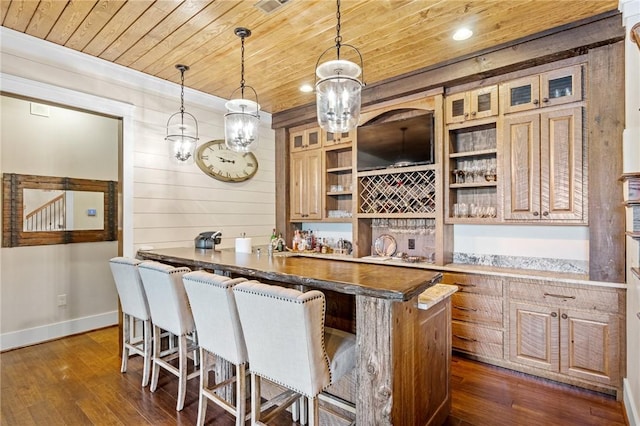 194 Cool Water Way, Sunset, SC 29685 - indoor wet bar with wood ceiling, wooden walls, dark wood-style floors, baseboards, and decorative light fixtures