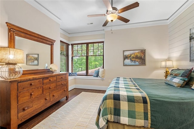 194 Cool Water Way, Sunset, SC 29685 - bedroom with dark wood-type flooring, ornamental molding, baseboards, wooden walls, and ceiling fan