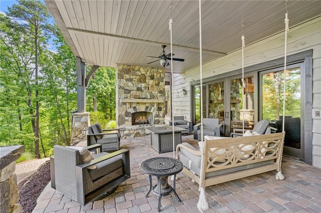 194 Cool Water Way, Sunset, SC 29685 - view of patio / terrace with an outdoor living space with a fireplace and french doors
