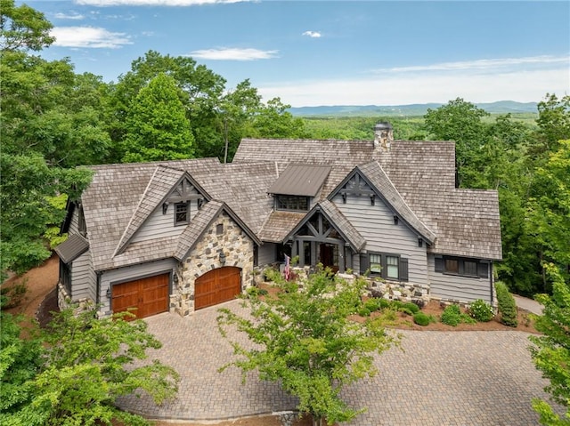 194 Cool Water Way, Sunset, SC 29685 - view of front of house with stone siding, decorative driveway, and a chimney
