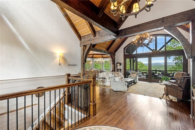194 Cool Water Way, Sunset, SC 29685 - sitting room featuring a chandelier, high vaulted ceiling, an upstairs landing, healthy amount of natural light, and wood ceiling with exposed beams