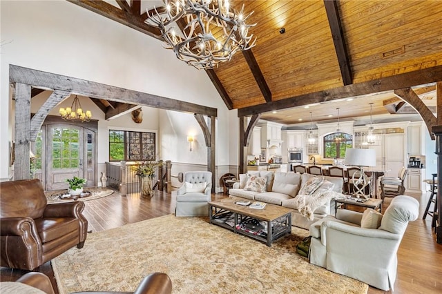 194 Cool Water Way, Sunset, SC 29685 - living room featuring a chandelier, wood finished floors, high vaulted ceiling, wood ceiling with exposed beams, and arched walkways
