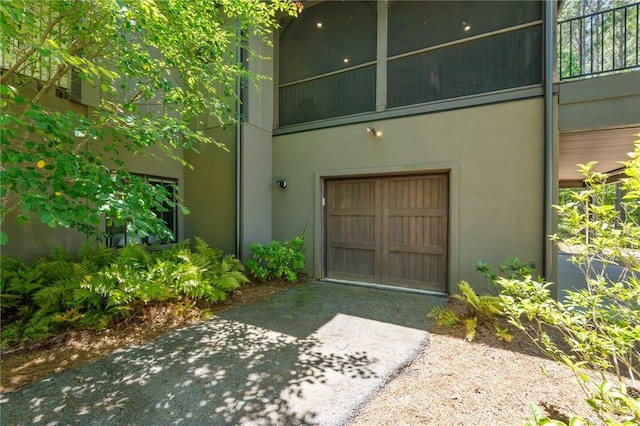 251 Settlement Blvd, Sunset, SC 29685 - view of exterior entry with driveway, an attached garage, and stucco siding