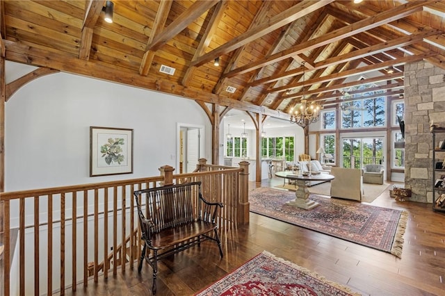 251 Settlement Blvd, Sunset, SC 29685 - sitting room with wood ceiling with exposed beams, high vaulted ceiling, a chandelier, hardwood / wood-style floors, and an upstairs landing