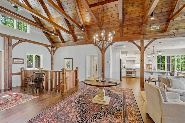 251 Settlement Blvd, Sunset, SC 29685 - living area featuring a chandelier, wood ceiling with exposed beams, hardwood / wood-style flooring, plenty of natural light, and high vaulted ceiling