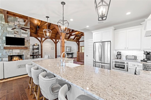 251 Settlement Blvd, Sunset, SC 29685 - kitchen featuring stainless steel appliances, a sink, a chandelier, open floor plan, and wood ceiling