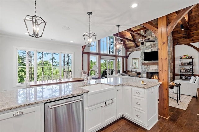 251 Settlement Blvd, Sunset, SC 29685 - kitchen with dishwasher, open floor plan, a sink, a ceiling fan, and a fireplace