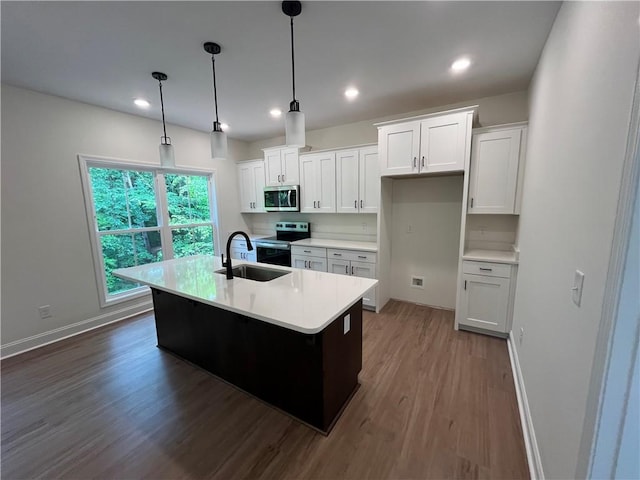 116 Fern Cir, Clemson, SC 29631 - kitchen featuring appliances with stainless steel finishes, a sink, dark wood finished floors, baseboards, and white cabinetry