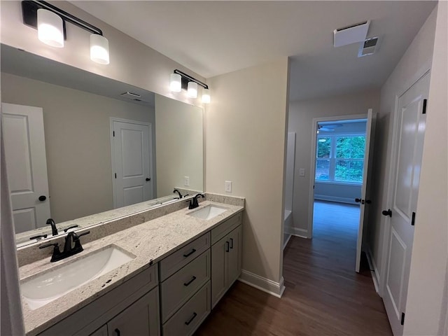 116 Fern Cir, Clemson, SC 29631 - full bathroom with double vanity, wood finished floors, baseboards, and a tub