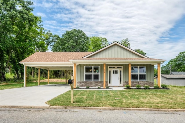 106 N St, Belton, SC 29627 - view of front of property featuring a carport, a front yard, driveway, roof with shingles, and stone siding