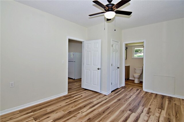 208 Aiken St, Central, SC 29630 - unfurnished bedroom with freestanding refrigerator, light wood-style flooring, baseboards, and ensuite bath