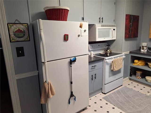 709 Ferry St, Anderson, SC 29626 - kitchen featuring white appliances, light flooring, and dark countertops