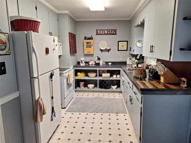 709 Ferry St, Anderson, SC 29626 - kitchen with white appliances, dark countertops, light flooring, ornamental molding, and a sink
