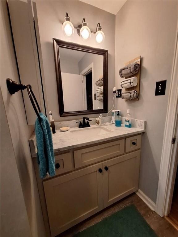 709 Ferry St, Anderson, SC 29626 - bathroom with vanity, wood finished floors, and baseboards