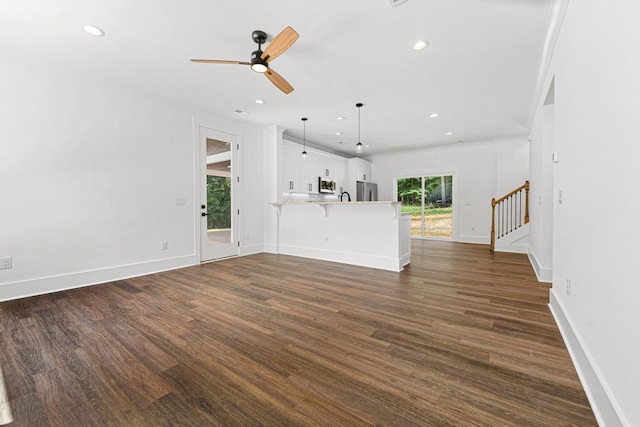100 Plum Ct, Westminster, SC 29693 - unfurnished living room featuring dark wood-type flooring, a ceiling fan, recessed lighting, stairway, and baseboards