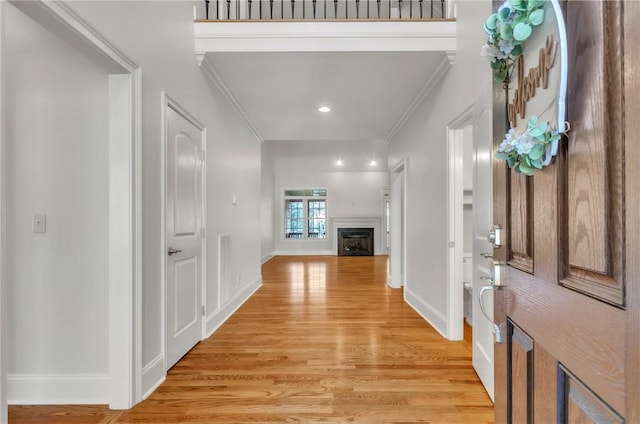 206 Waverly Hall Ln, Simpsonville, SC 29681 - entrance foyer featuring crown molding, light wood finished floors, a fireplace, recessed lighting, and baseboards