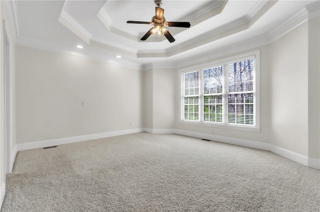 206 Waverly Hall Ln, Simpsonville, SC 29681 - unfurnished room with a tray ceiling, carpet floors, crown molding, a ceiling fan, and baseboards