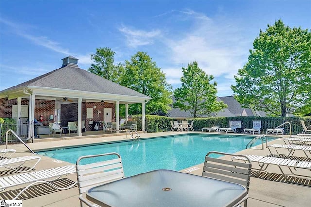 206 Waverly Hall Ln, Simpsonville, SC 29681 - community pool featuring a patio, a ceiling fan, and outdoor dining area