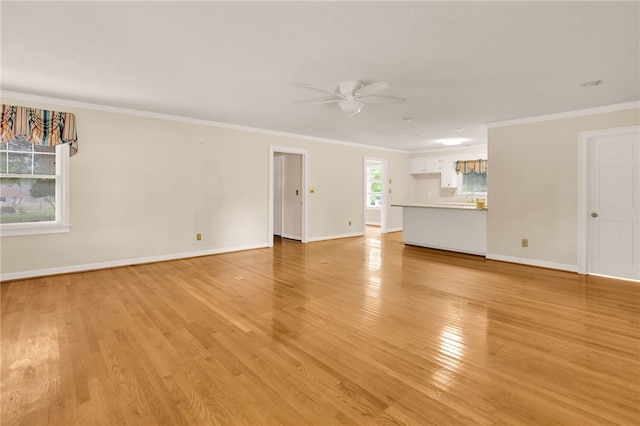 1142 Fox Squirrel Ridge Rd, Pickens, SC 29671 - unfurnished living room with ceiling fan, ornamental molding, baseboards, and light wood-style floors