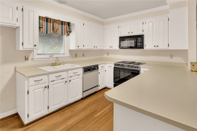 1142 Fox Squirrel Ridge Rd, Pickens, SC 29671 - kitchen featuring dishwasher, black microwave, range with electric stovetop, a sink, and light wood-style flooring