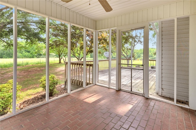 1142 Fox Squirrel Ridge Rd, Pickens, SC 29671 - unfurnished sunroom featuring a ceiling fan and view of scattered trees