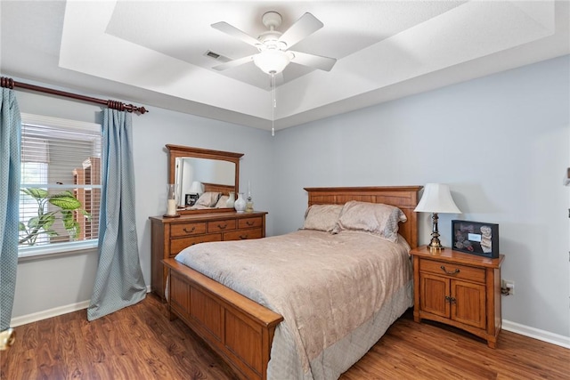 104 Brittania Cir, Anderson, SC 29621 - bedroom featuring a raised ceiling, baseboards, wood finished floors, and ceiling fan