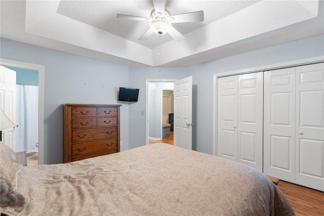 104 Brittania Cir, Anderson, SC 29621 - bedroom with a raised ceiling, wood finished floors, a closet, a ceiling fan, and connected bathroom