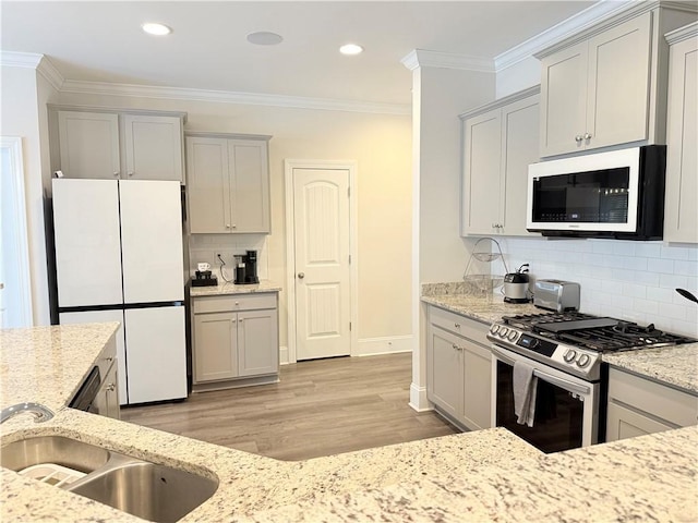 479 Twin View Dr, Westminster, SC 29693 - kitchen featuring white appliances, light stone countertops, backsplash, light wood-style floors, and crown molding
