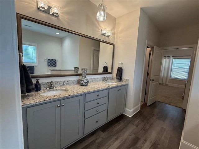479 Twin View Dr, Westminster, SC 29693 - full bathroom with wood finished floors, double vanity, baseboards, and healthy amount of natural light