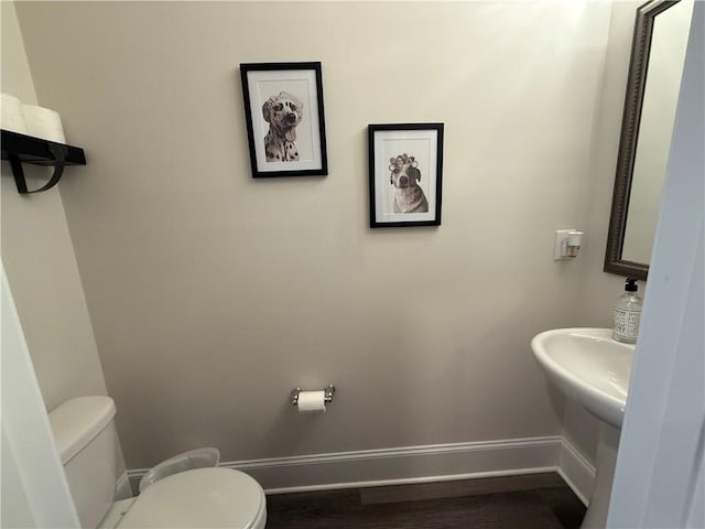 479 Twin View Dr, Westminster, SC 29693 - half bathroom featuring toilet, baseboards, and wood finished floors