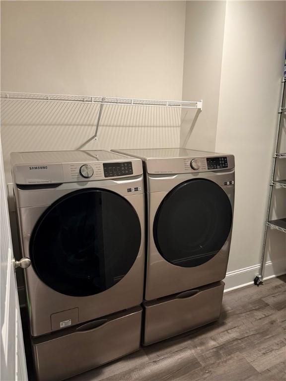 479 Twin View Dr, Westminster, SC 29693 - laundry area with washer and dryer, wood finished floors, and baseboards