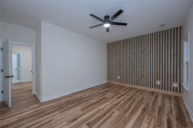2413 Annandale Dr, Anderson, SC 29621 - spare room featuring a ceiling fan, light wood-style floors, and baseboards