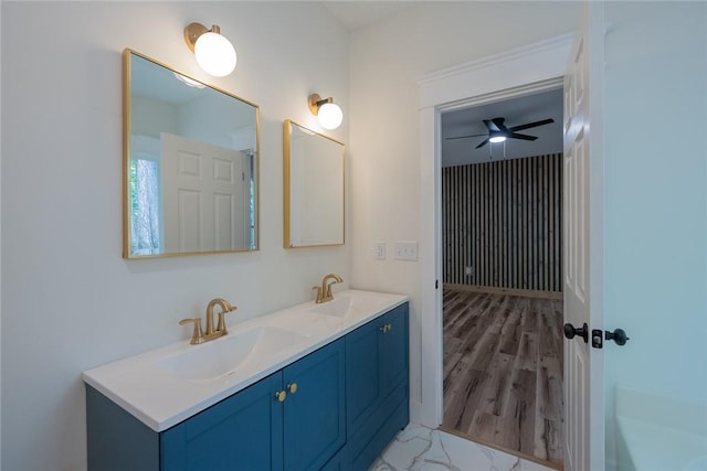2413 Annandale Dr, Anderson, SC 29621 - bathroom featuring double vanity, a ceiling fan, a tub, and wood finished floors