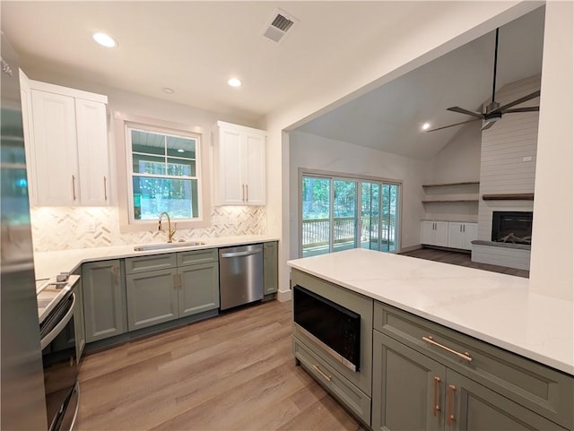 36 Pine Garden Way Dr, Salem, SC 29676 - kitchen with stainless steel appliances, backsplash, light countertops, light wood-type flooring, and recessed lighting