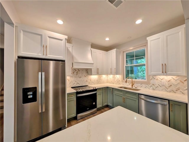 36 Pine Garden Way Dr, Salem, SC 29676 - kitchen with appliances with stainless steel finishes, green cabinetry, custom exhaust hood, light countertops, and recessed lighting