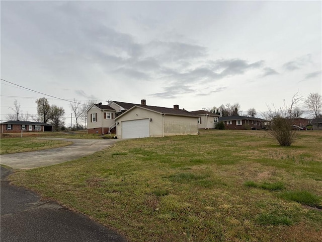 611 E S 6th St, Seneca, SC 29678 - view of home's exterior featuring driveway, a yard, and an attached garage